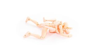 Two plastic models demonstrating the correct position for the coital alignment technique