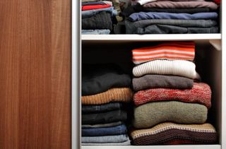 Jumpers in wardrobe