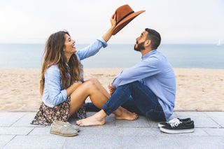 outdoor date ideas - couple having fun together on the beach