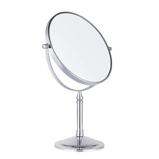 A silver pedestal mirror