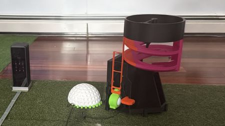 3D printed golf products on a golf mat