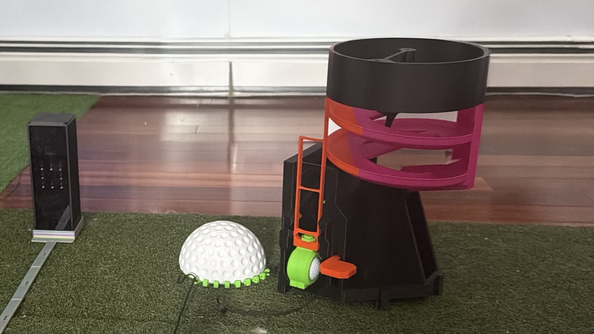 3D printed golf products on a golf mat