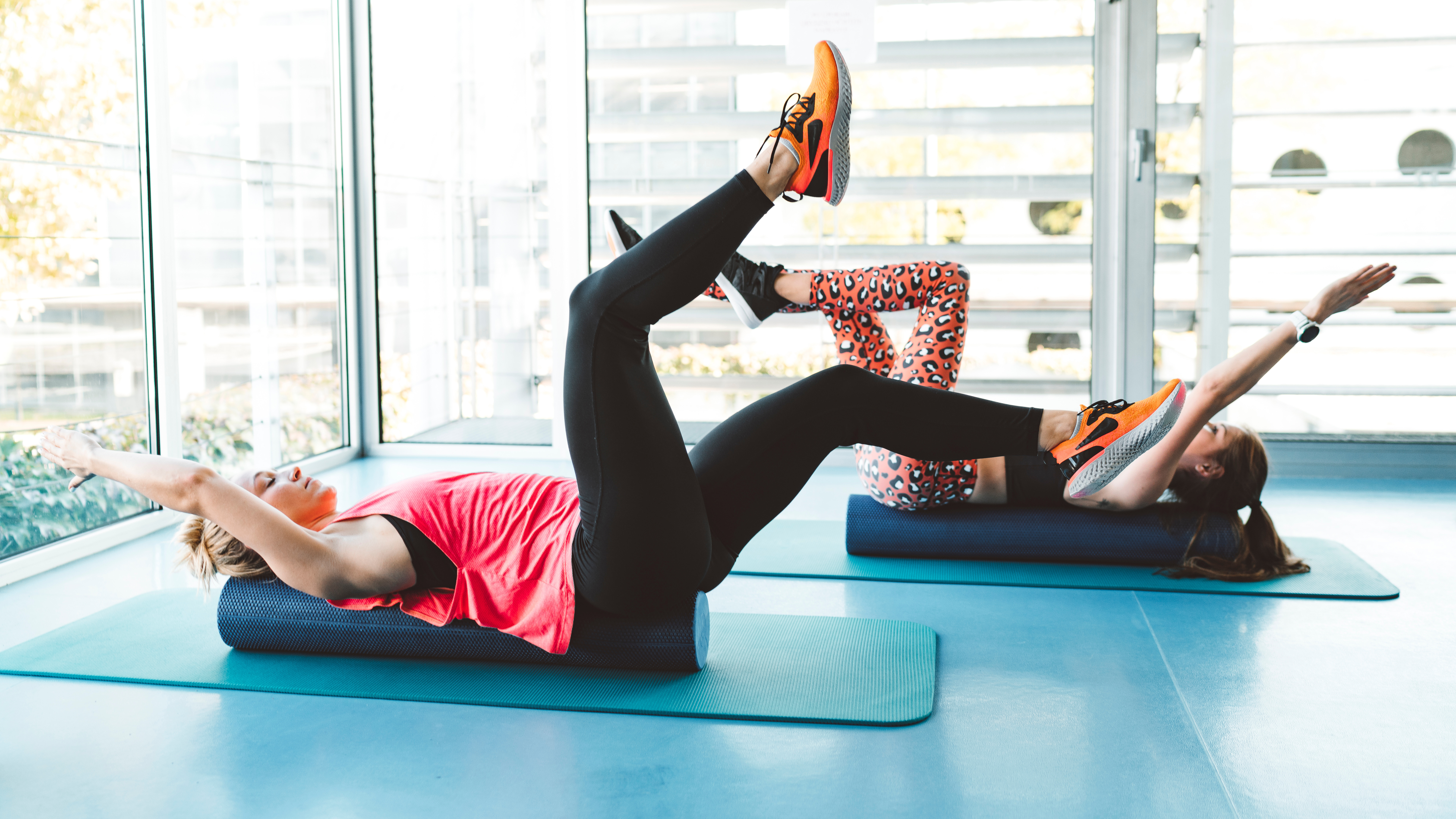 Women performing dead bug exercise during a class