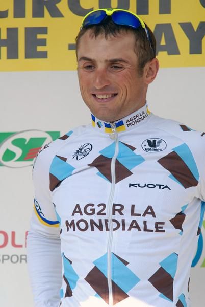 Yuriy Krivtsov (Ag2R La Mondiale) on the podium for the mountains classification jersey.