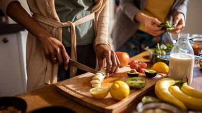 two women cooking a healthy meal