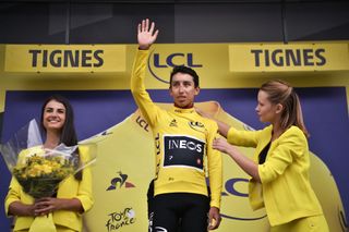 Egan Bernal (Team Ineos) is assisted with his yellow jersey after taking the race lead after stage 19 of the 2019 Tour de France in Tignes. In 2020, only one female hostess and one male host will take part in the Tour’s podium protocol