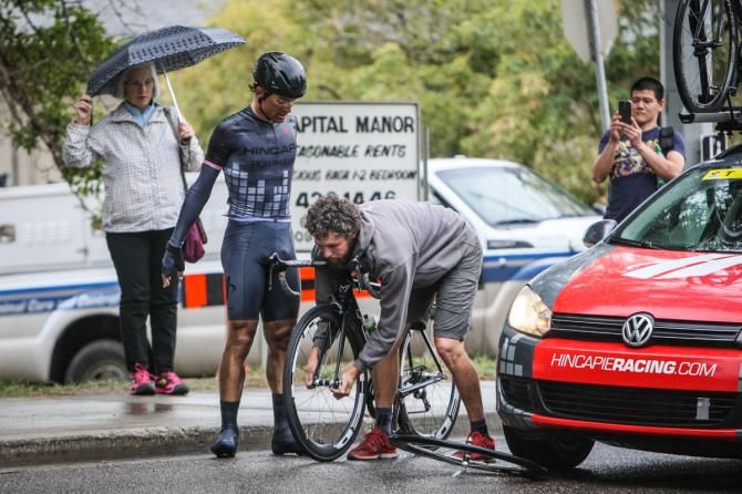 Rob Carpenter (Hincapie) waits for a wheel change on the final lap