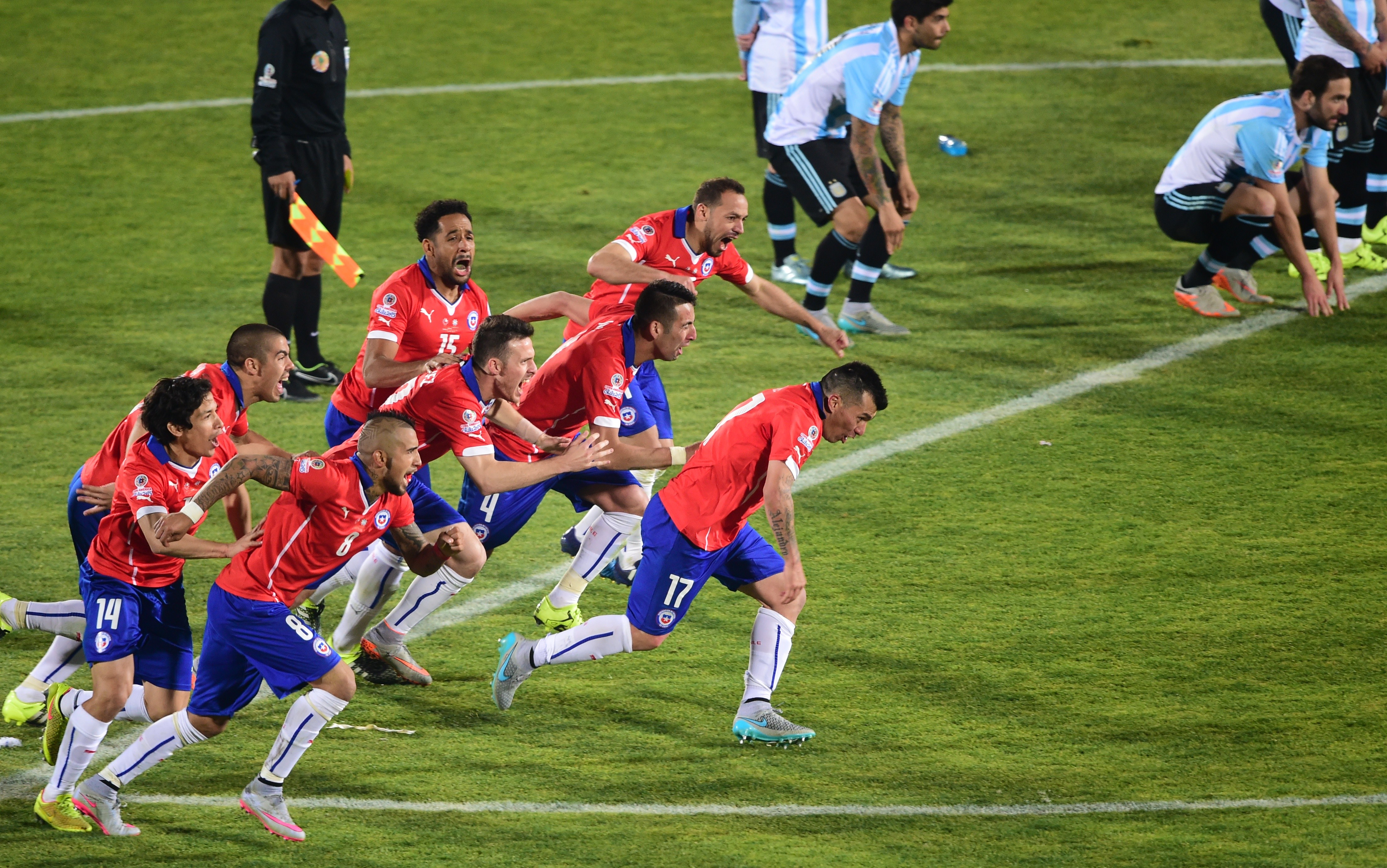 Chile players celebrate victory on penalties against Argentina in the final of the Copa America in 2015.