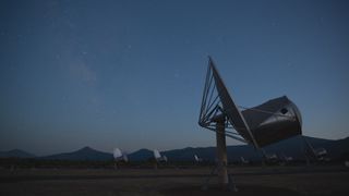 SETI's Allen Telescope Array scans the sky in Hat Creek, California, as twilight settles around it.