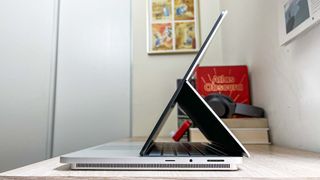 Microsoft Surface Laptop Studio 2 review unit on desk with side facing camera