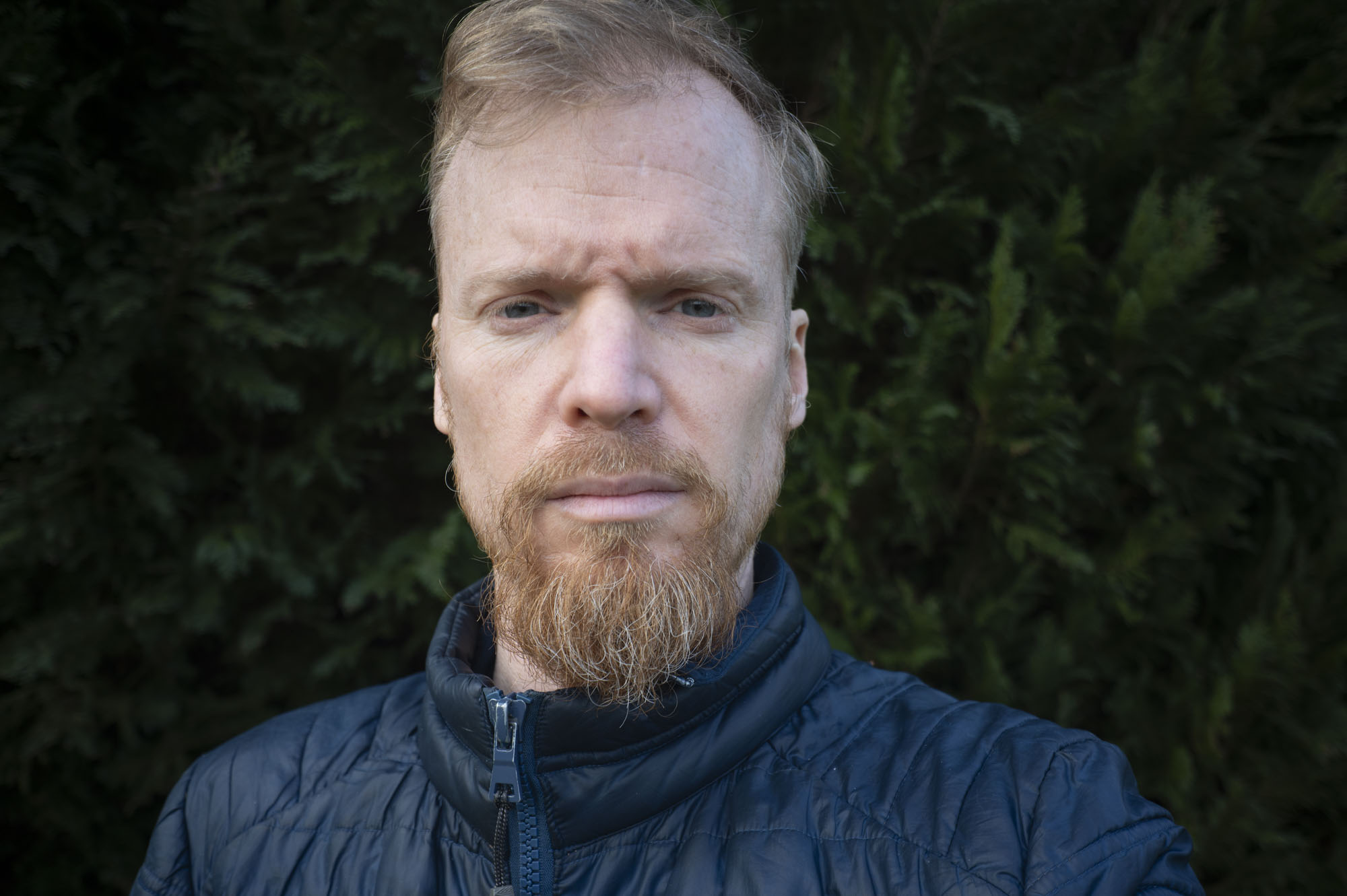 Viltrox AF 28mm F4.5 image gallery: selfie of a man in front of a tree