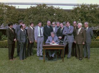 Jimmy Carter signs Medicare-Medicaid Anti-Fraud and Abuse Amendments into law. ca. 10/25/1977. (Photo by: Hum Images/Universal Images Group via Getty Images)