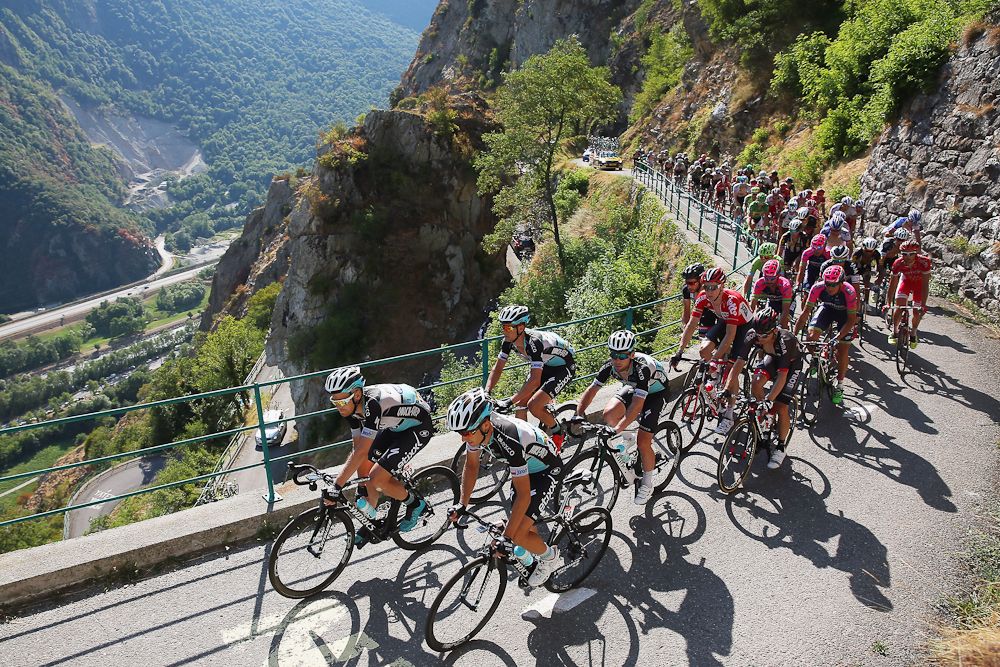 The peloton climbs during stage 18 in the Alps.