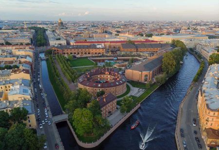 An aerial photo of Holland Island which has many buildings and a park and is surrounded by a river.