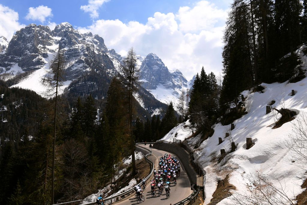 PIEVEDIBONO ITALY APRIL 22 The peloton passing through Folgarida 1351m landscape during the 44th Tour of the Alps 2021 Stage 4 a 1686 to stage from Naturns to Valle del Chiese Pieve di Bono TourofTheAlps Mountains Snow Forest TouroftheAlps on April 22 2021 in Pieve di Bono Italy Photo by Tim de WaeleGetty Images