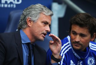 Chelsea manager Jose Mourinho talks with assistant manager Rui Faria during a Premier League match against Manchester City, 2015