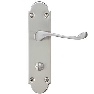 Chrome effect scroll door handle to suggest how to make a home look expensive by changing door furniture