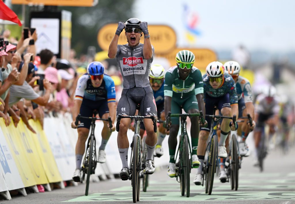 SAINTAMANDMONTROND FRANCE JULY 09 LR Jasper Philipsen of Belgium and Team Alpecin Deceuninck celebrates at finish line as stage winner ahead of Biniam Girmay of Eritrea and Team Intermarche Wanty Green Sprint Jersey during the 111th Tour de France 2024 Stage 10 a 1873km stage from Orleans to SaintAmandMontrond UCIWT on July 09 2024 in Orleans France Photo by Tim de WaeleGetty Images