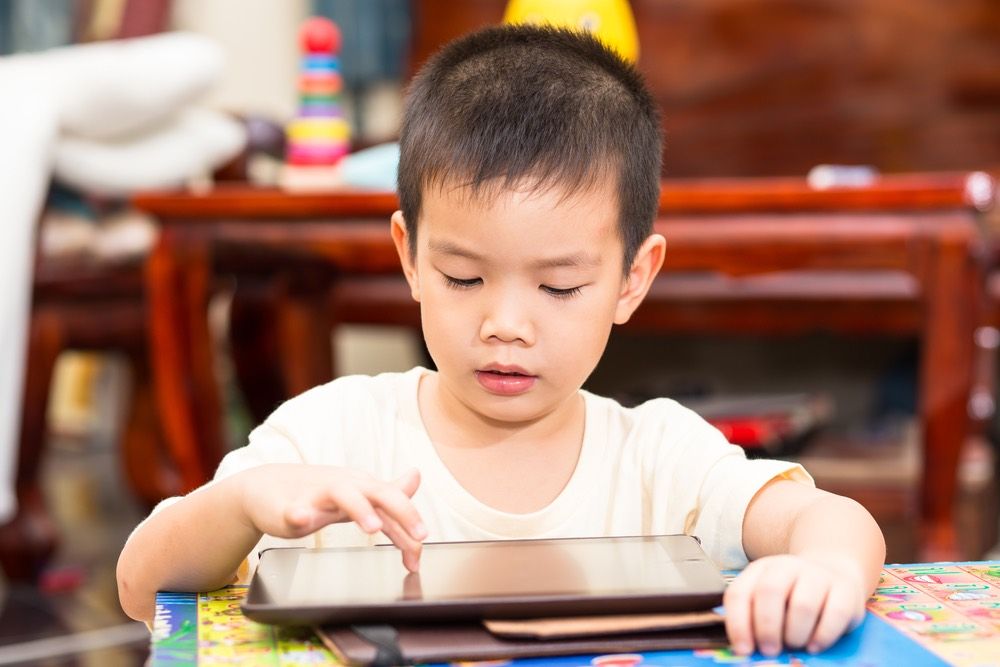 Young boy on ipad.