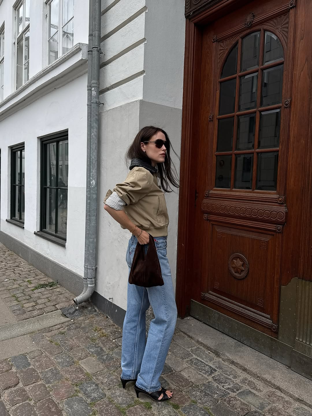 woman wearing chic denim outfit fall 2025