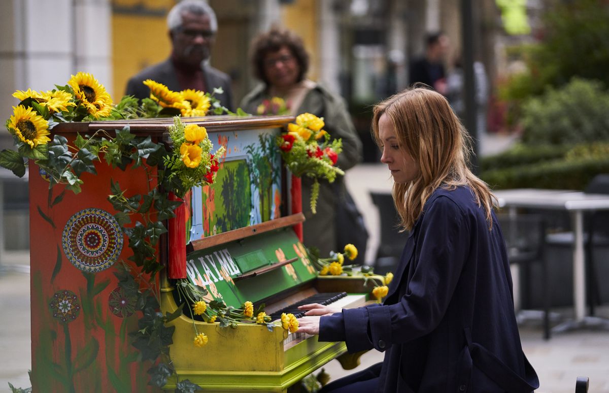 Angela Black playing the piano in episode 6