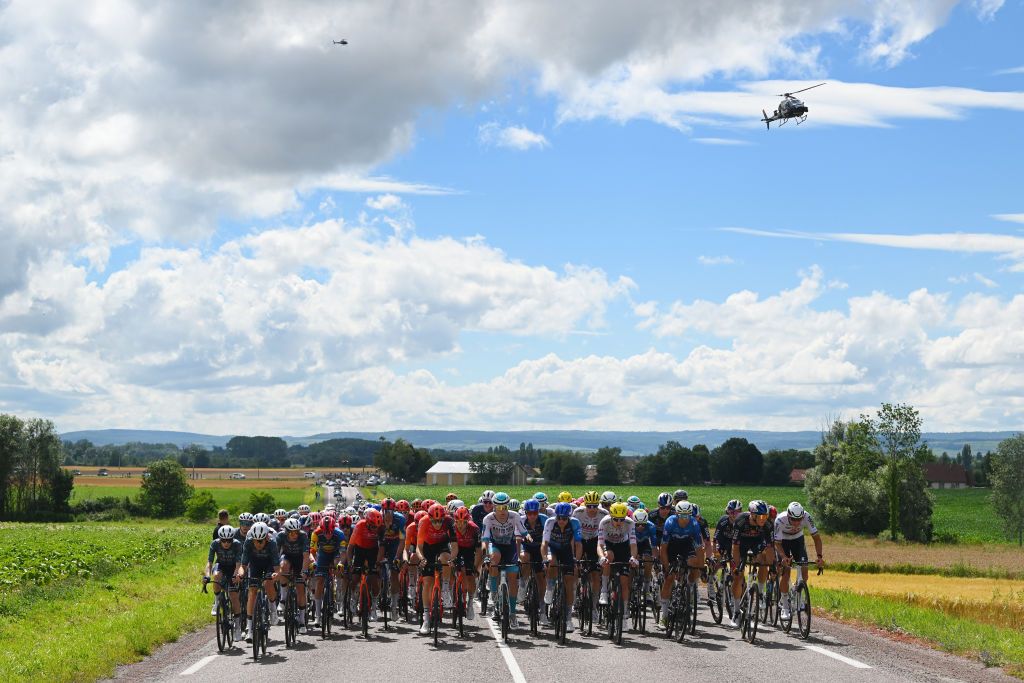 DIJON FRANCE JULY 04 A general view of Jonas Vingegaard Hansen of Denmark Tiesj Benoot of Belgium Bart Lemmen of Netherlands and Team Visma Lease a Bike Toms Skujins of Latvia Giulio Ciccone of Italy and Team Lidl Trek Egan Bernal of Colombia and Team INEOS Grenadiers Jasper Stuyven of Belgium and Team Lidl Trek Ben Turner of The United Kingdom Michal Kwiatkowski of Poland and Team INEOS Grenadiers Pascal Ackermann of Germany Jakob Fuglsang of Denmark and Team Israel Premier Tech Tim Wellens of Belgium Pavel Sivakov of France and UAE Team Emirates Enric Mas of Spain Davide Formolo of Italy and Movistar Team Danny van Poppel of Netherlands and Team Red Bull BORA hansgrohe Mathieu van der Poel of Netherlands and Team Alpecin Deceuninck and the peloton competing during the 111th Tour de France 2024 Stage 6 a 1635km stage from Macon to Dijon UCIWT on July 04 2024 in Dijon France Photo by Dario BelingheriGetty Images