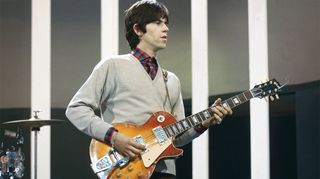 English guitarist Keith Richards of rock group The Rolling Stones plays a Gibson Les Paul guitar with Bigsby Vibrato on the set of the ABC Television pop music television show Thank Your Lucky Stars at Alpha Television Studios in Birmingham, England on 21st March 1965. The band would play four songs on the show, The Last Time, Play With Fire, Off The Hook and Everybody Needs Somebody To Love, which would be broadcast on 27th March.
