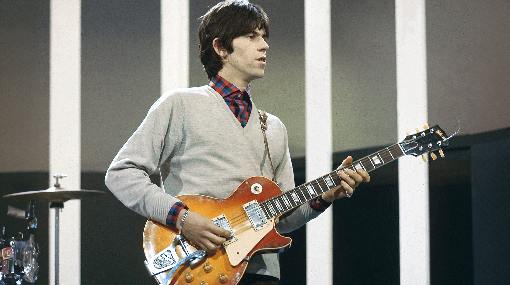 English guitarist Keith Richards of rock group The Rolling Stones plays a Gibson Les Paul guitar with Bigsby Vibrato on the set of the ABC Television pop music television show Thank Your Lucky Stars at Alpha Television Studios in Birmingham, England on 21st March 1965. The band would play four songs on the show, The Last Time, Play With Fire, Off The Hook and Everybody Needs Somebody To Love, which would be broadcast on 27th March. 