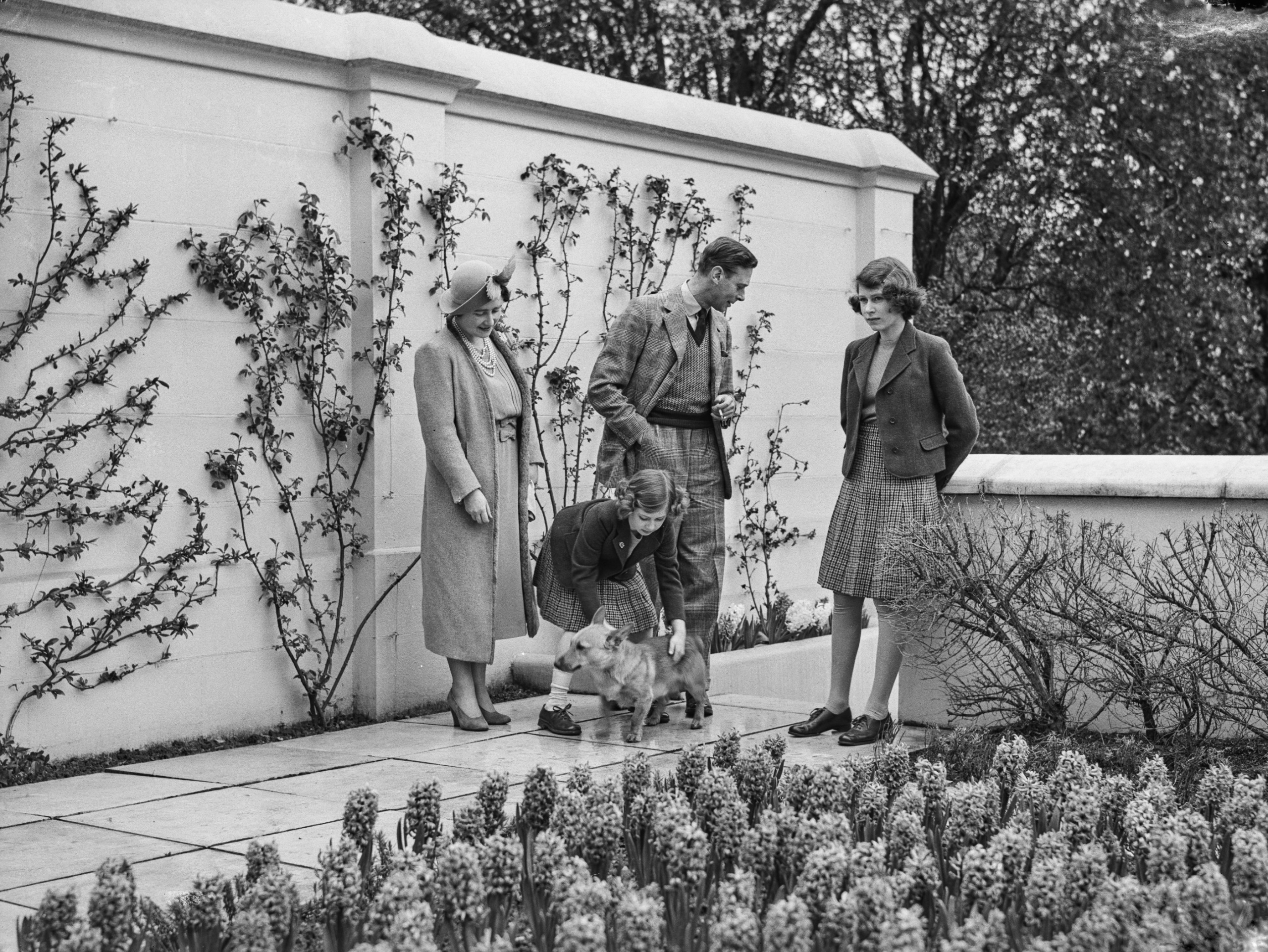 The Queen Mother, King George VI, Princess Margaret and Princess Elizabeth in the garden at Royal Lodge