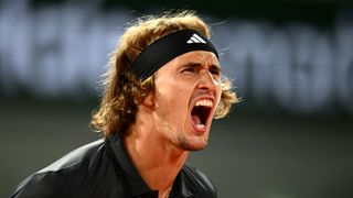 : Alexander Zverev of Germany celebrates winning match point against Frances Tiafoe of United States during the Men's Singles Third Round Match on Day Seven of the 2023 French Open at Roland Garros 