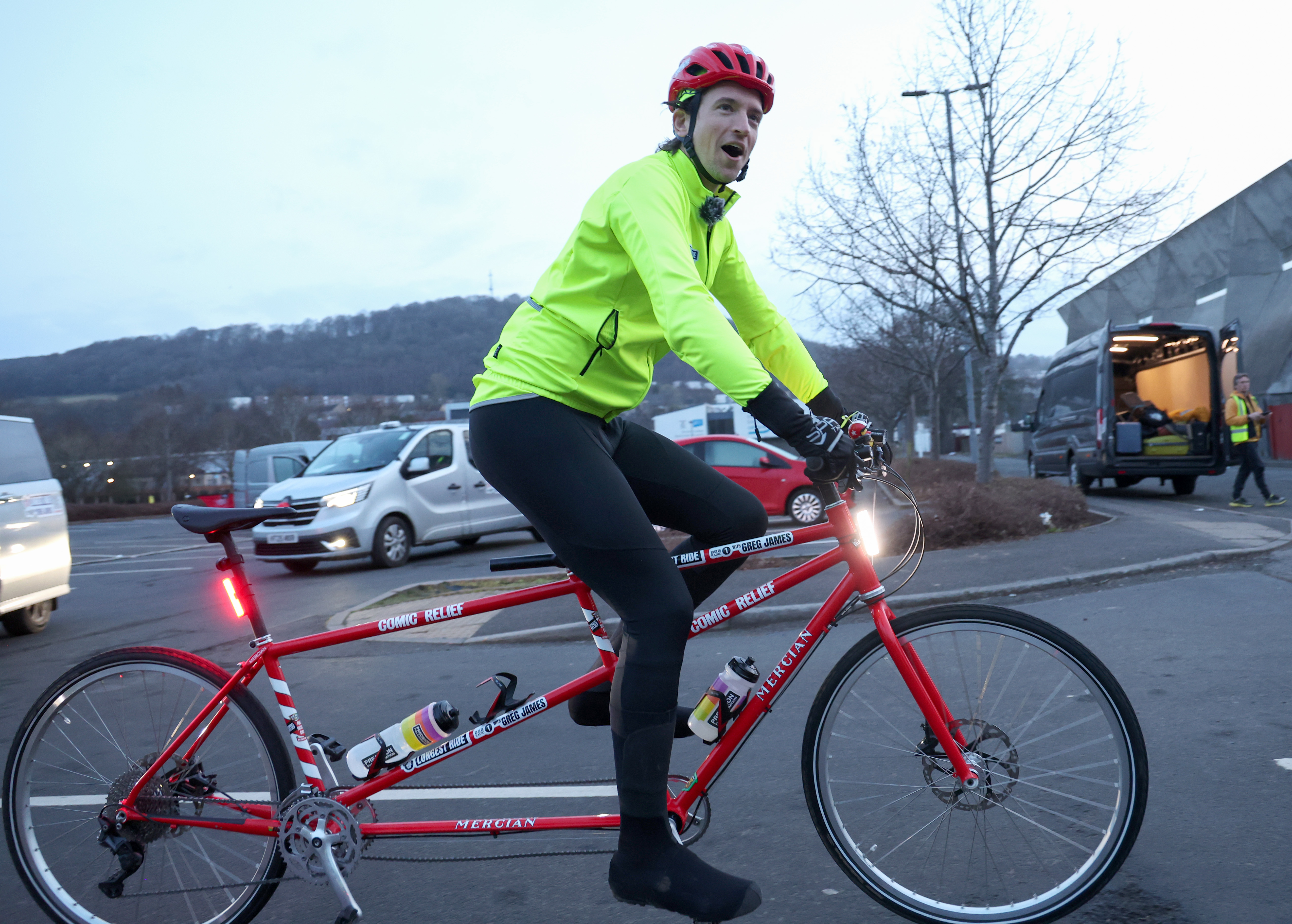 Greg James on a tandem