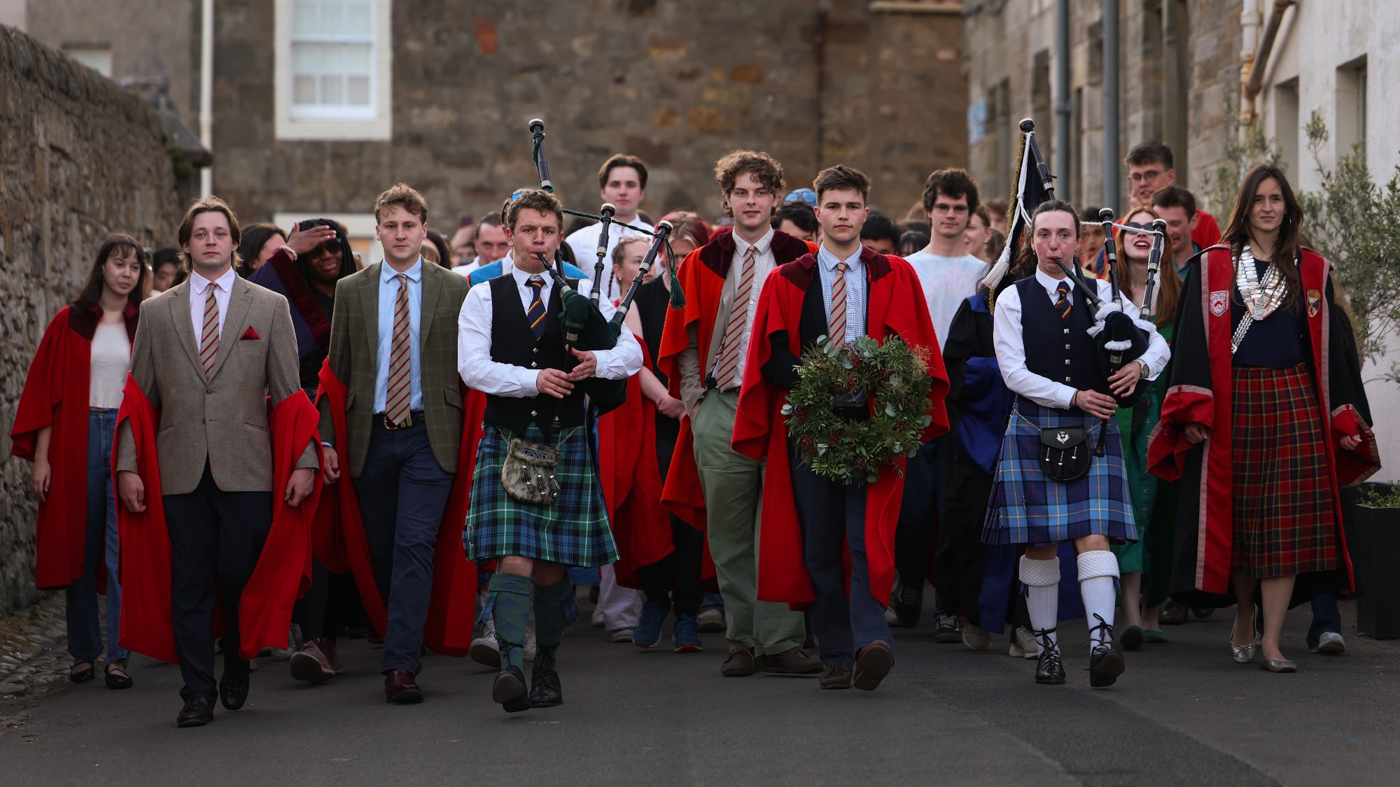Bagpipers and students in gowns take part in the University of St Andrews' annual Gaudie procession 