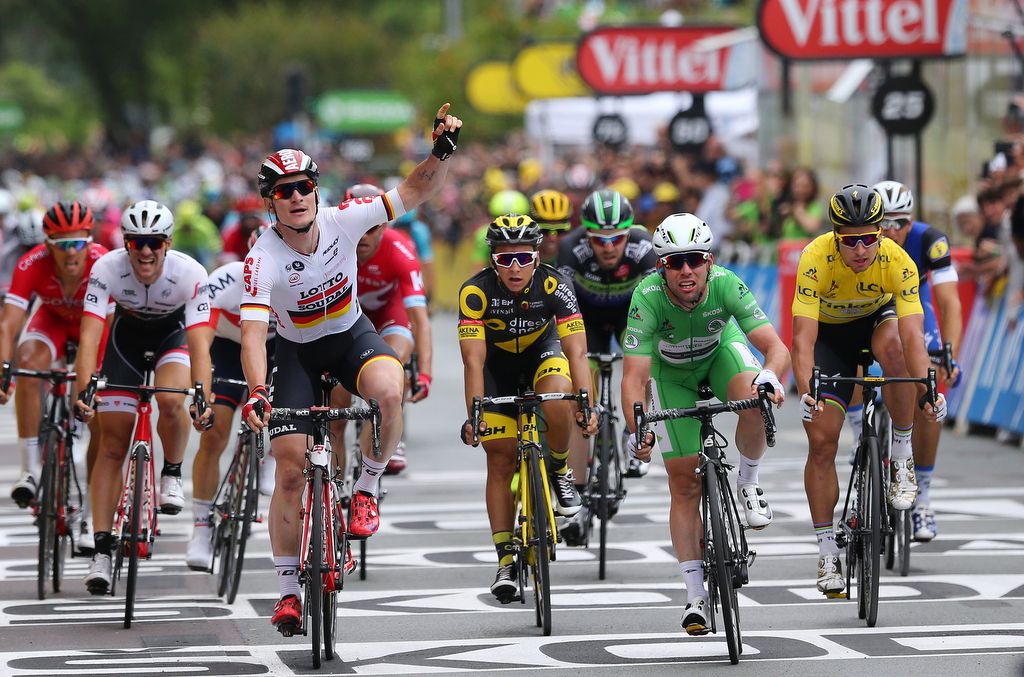 Andre Greipel celebrates but it was Mark Cavendish would be awarded the win in a photo finish