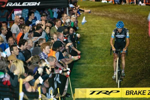 Danny Summerhill (Garmin-Cervelo) entertains the fans near the barriers.