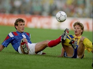 Franck Sauzee of France and Stefan Schwarz of Sweden in action during the European Championship Group 1 match at the Rasunda Stadium in Stockholm, Sweden. The match ended in a 1-1 draw.