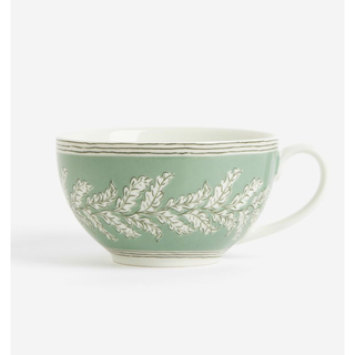 green porcelain tea cup with a leaf pattern