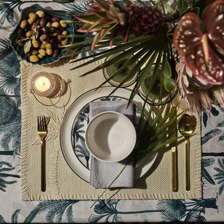 tableware with braided paper straw mats and embroidered palm tree