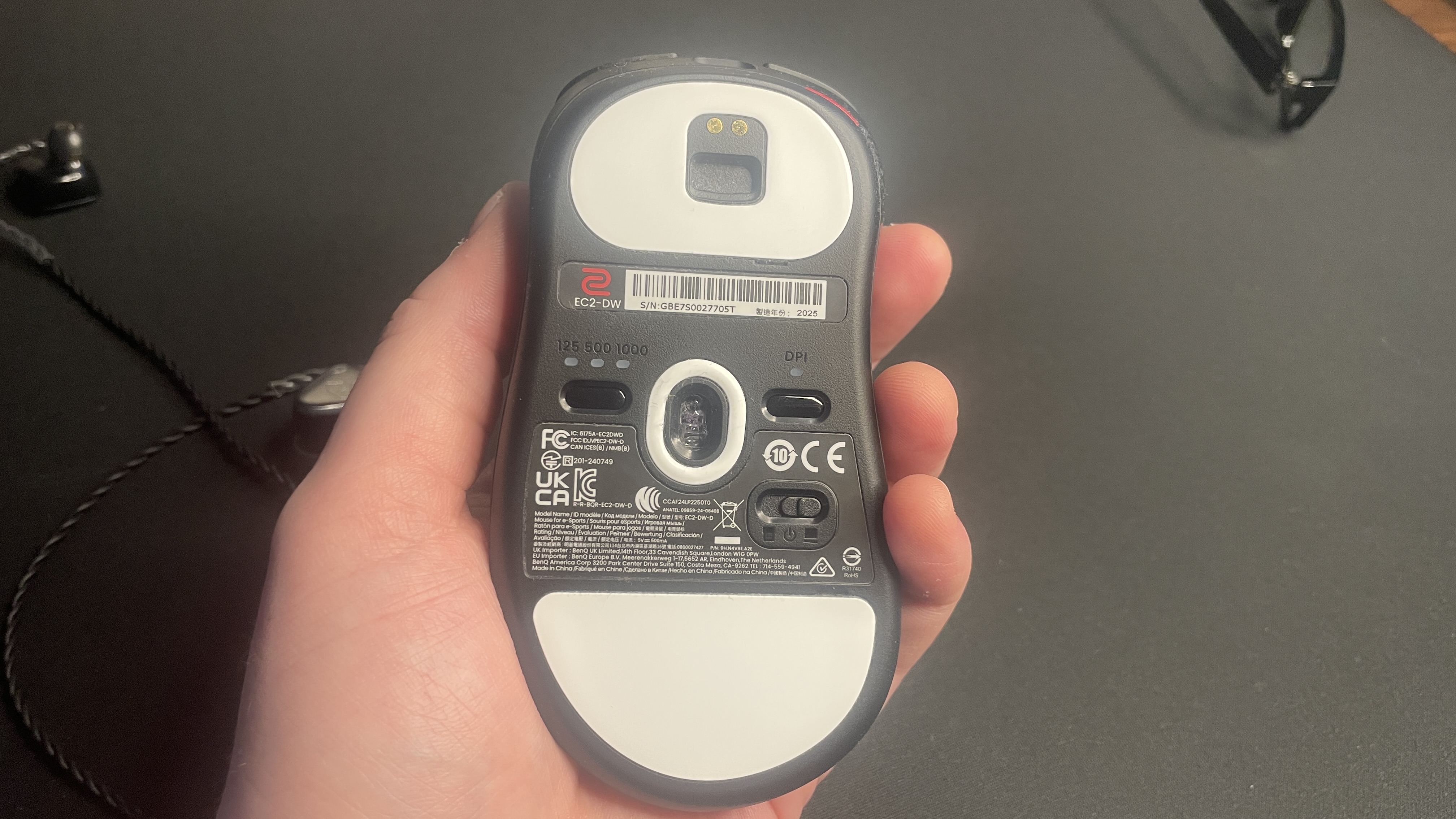 The underside of a Zowie EC2-DW gaming mouse.