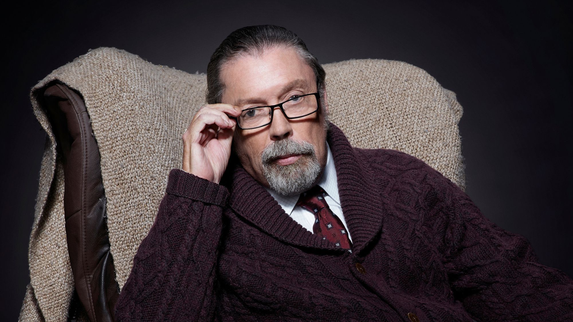 Tim Curry as Criminologist Narrator in THE ROCKY HORROR PICTURE SHOW: LET'S DO THE TIME WARP AGAIN