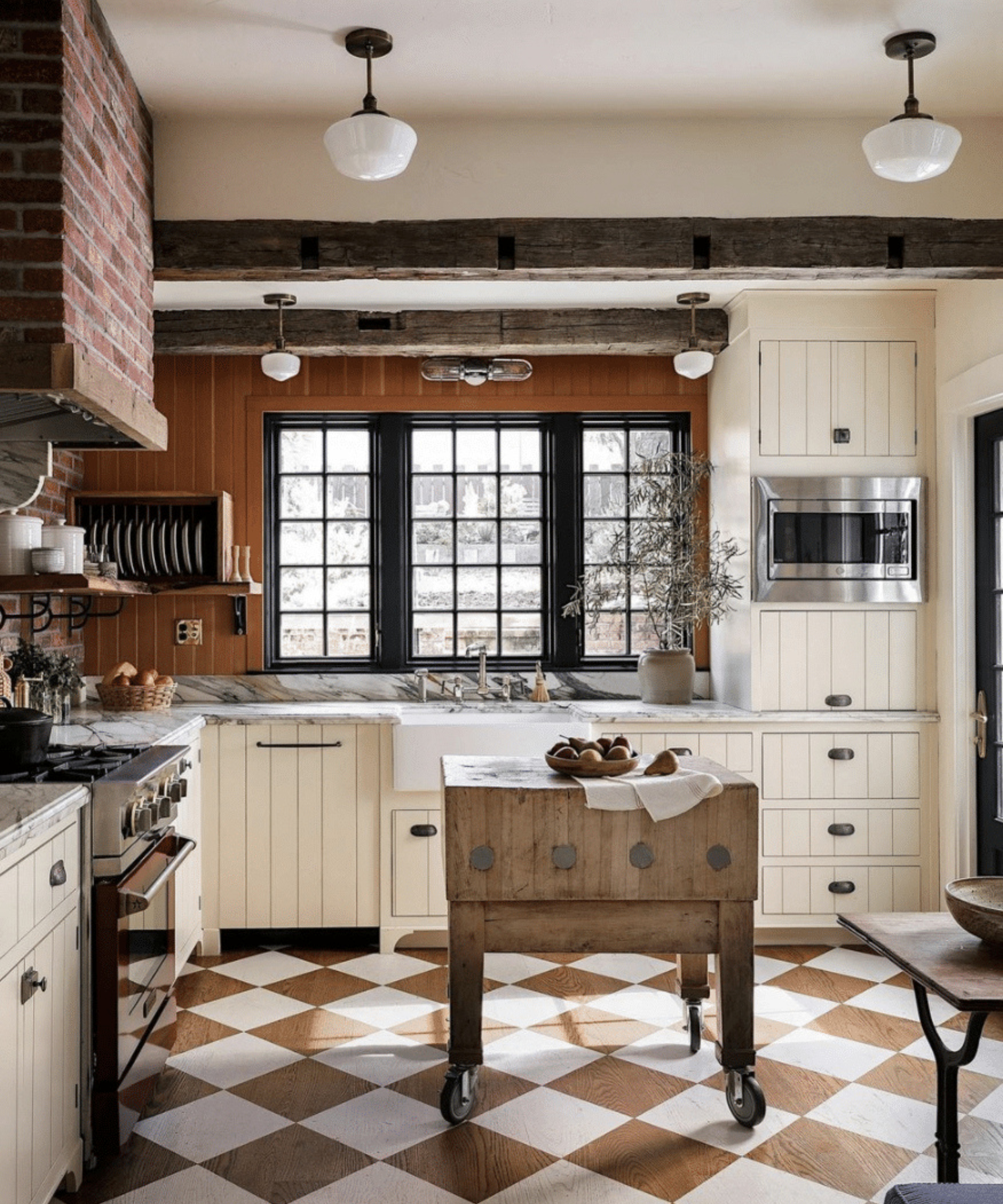 A San Francisco kitchen inspired by English country kitchens, with a wood flooring painted with a checkerboard design.
