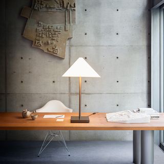 The lamp is shown immediately above in the Osaka office of Pritzker Prize