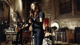 David Gilmour (foreground) performs with Pink Floyd at the abbey of Royaumont