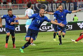 Amir Rrahmani celebrates after scoring for Kosovo against Turkey in 2017.