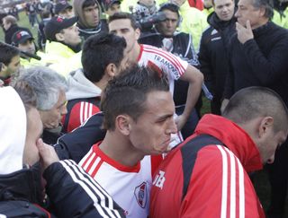 River Plate players in tears after relegation is confirmed following a game against Belgrano de Cordoba in June 2011.