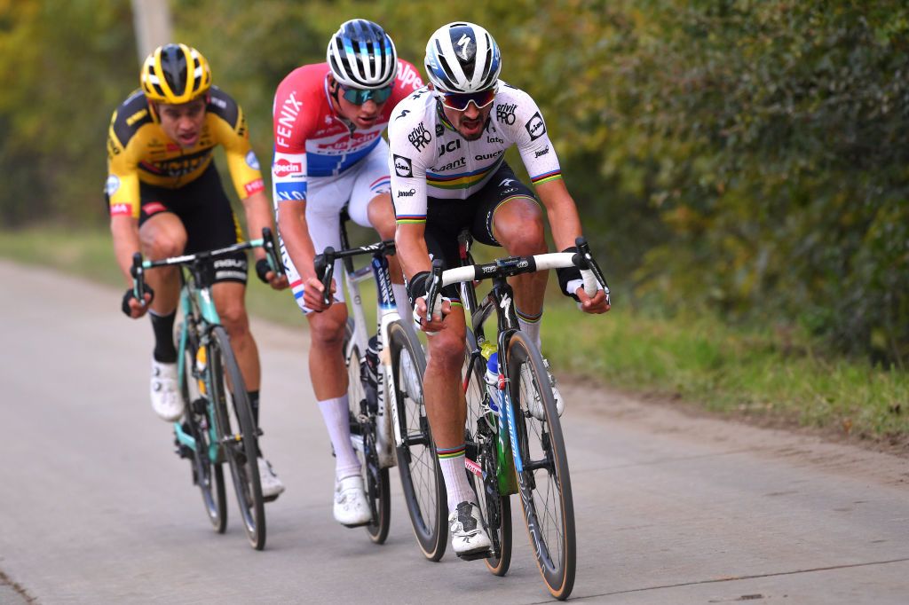 OUDENAARDE BELGIUM OCTOBER 18 Julian Alaphilippe of France and Team Deceuninck QuickStep World Champion Jersey Wout Van Aert of Belgium and Team Team Jumbo Visma Mathieu Van Der Poel of The Netherlands and Team AlpecinFenix Breakaway during the 104th Tour of Flanders 2020 Ronde van Vlaanderen Men Elite a 2433km race from Antwerpen to Oudenaarde RVV20 FlandersClassic on October 18 2020 in Oudenaarde Belgium Photo by Luc ClaessenGetty Images