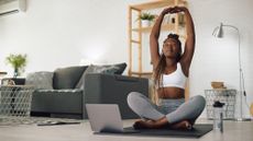 Woman doing yoga stretching at home