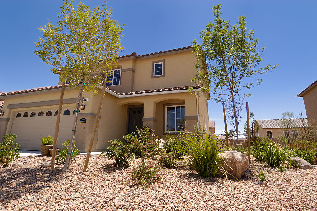 A house in Las Vegas with desert plants in the front yard.