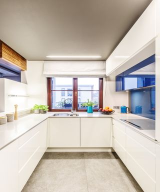 A narrow kitchen with gloss surfaces
