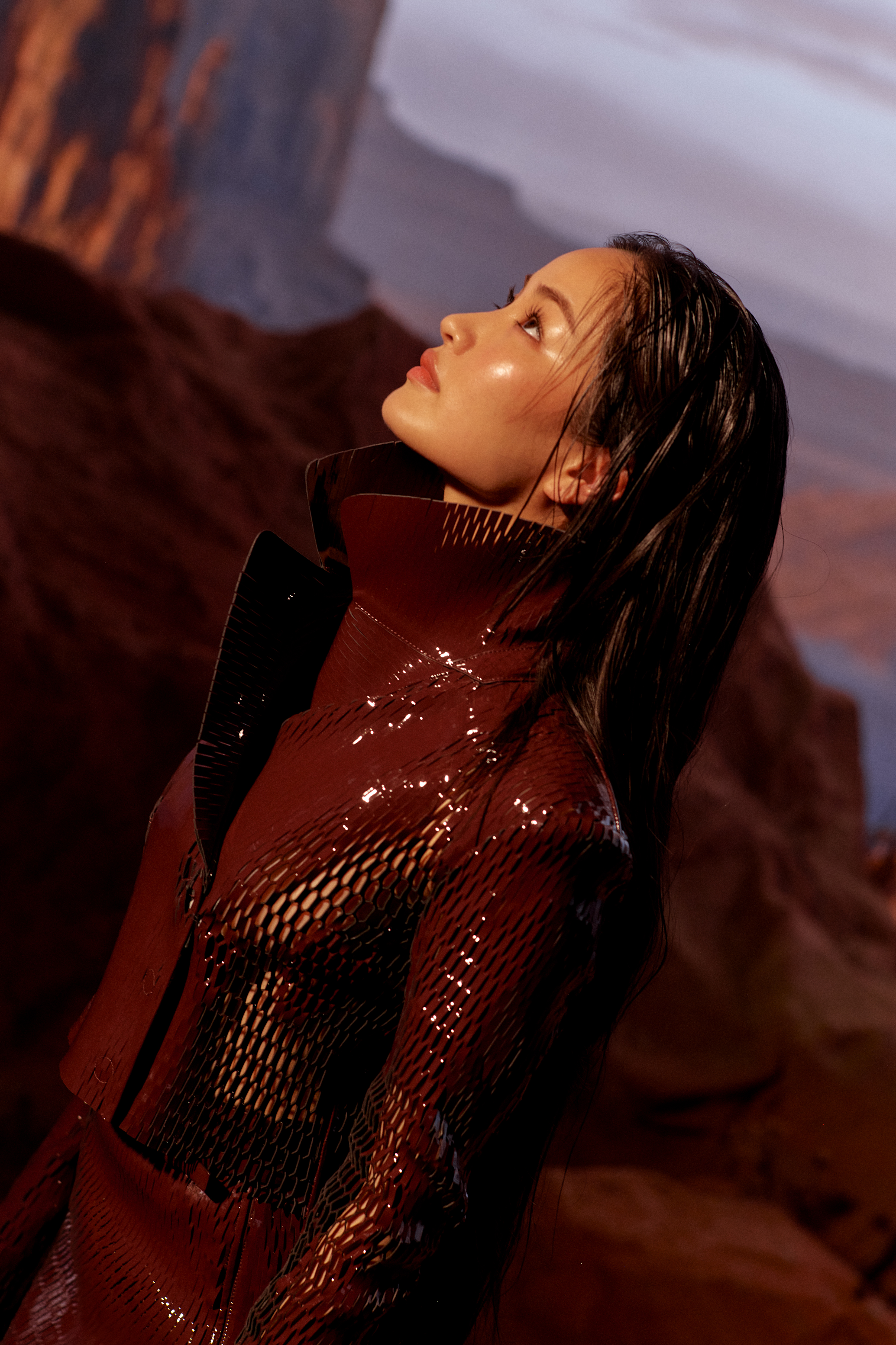 Anna Sawai poses for Marie Claire in a netted wine-colored leather jacket