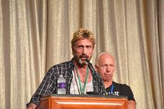 John McAfee speaking at an event